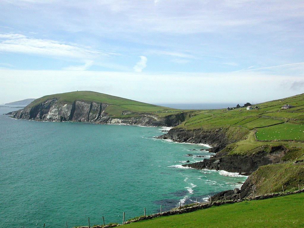 coastal cliffs and green hills