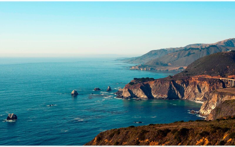 Coastal Cliffs and Ocean — Blue, Serene, Afternoon, Photograph, Rock Formations