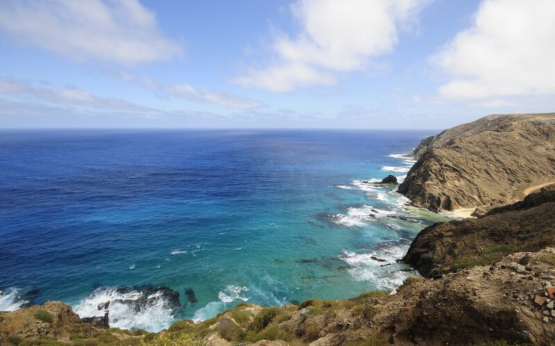 Coastal Cliffs and Ocean — Blue, Serene, Afternoon, Photograph, Sky, Brown