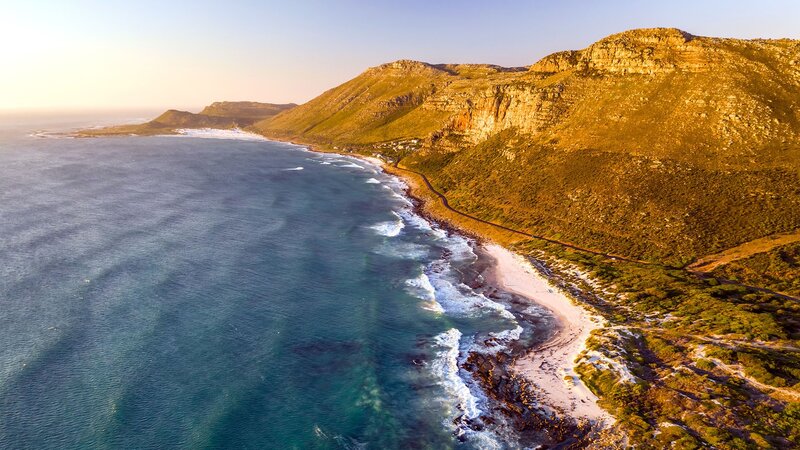 Coastal Cliffs and Ocean — Blue, Serene, Sunset