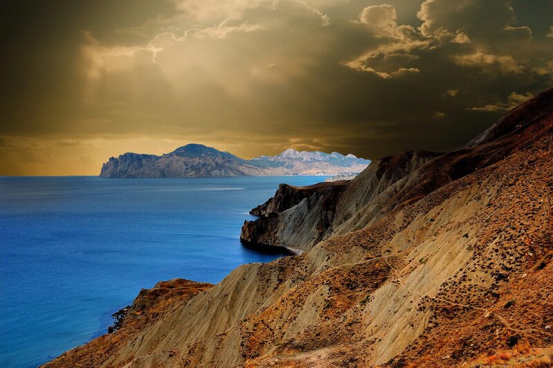 Coastal Cliffs and Sea — Blue, Dramatic, Sunset, Photograph