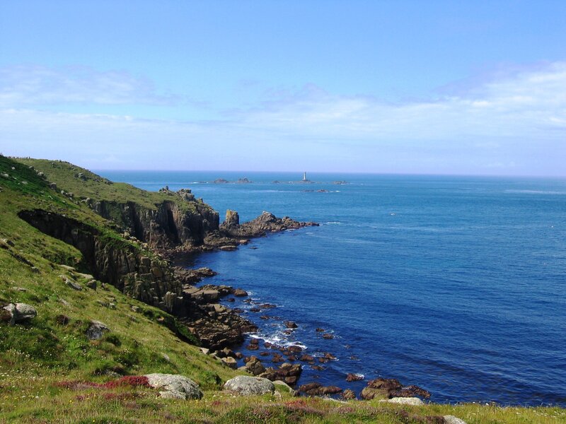 Coastal Cliffs and Sea — Blue, Serene, Afternoon, Photograph, Lighthouse