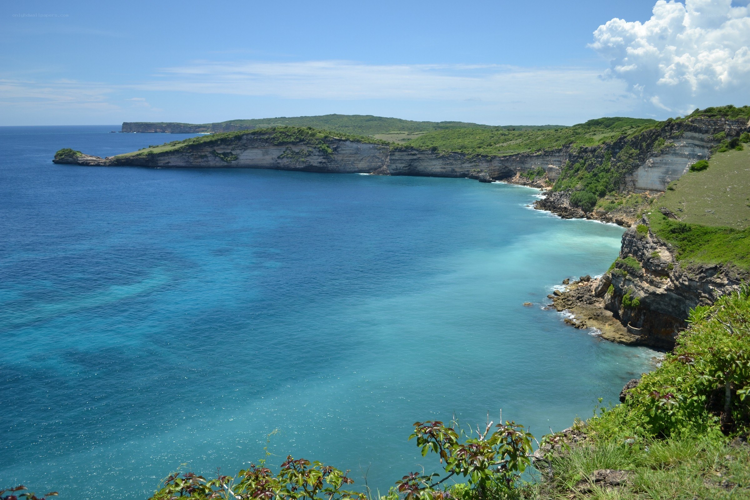 Coastal cliffs and turquoise bay