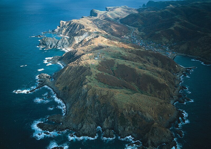 coastal cliffs and village aerial view
