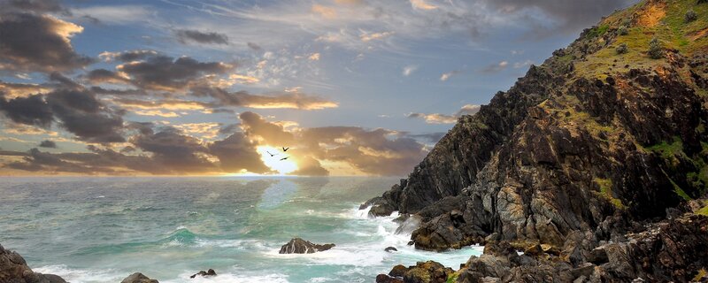 Coastal Cliffs at Sunset — Blue, Dramatic, Photograph, Ocean, Birds, Clouds, Orange
