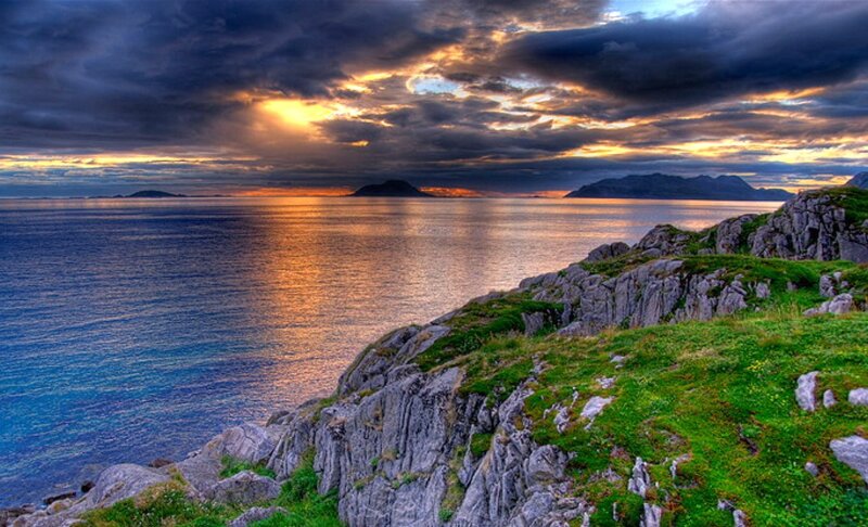 Coastal Cliffs at Sunset — Blue