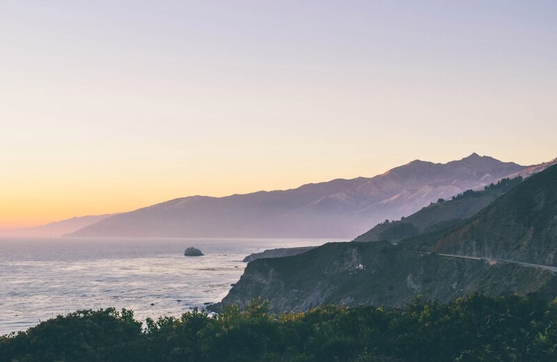 Coastal Cliffs at Sunset — Orange, Serene