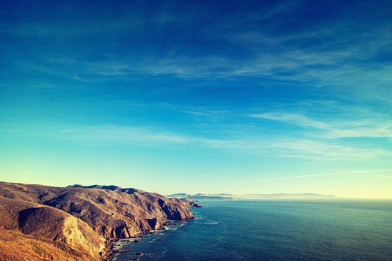 coastal cliffs under blue sky