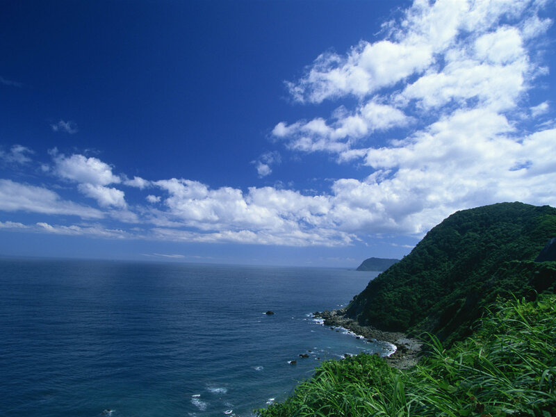 coastal cliffs under blue sky