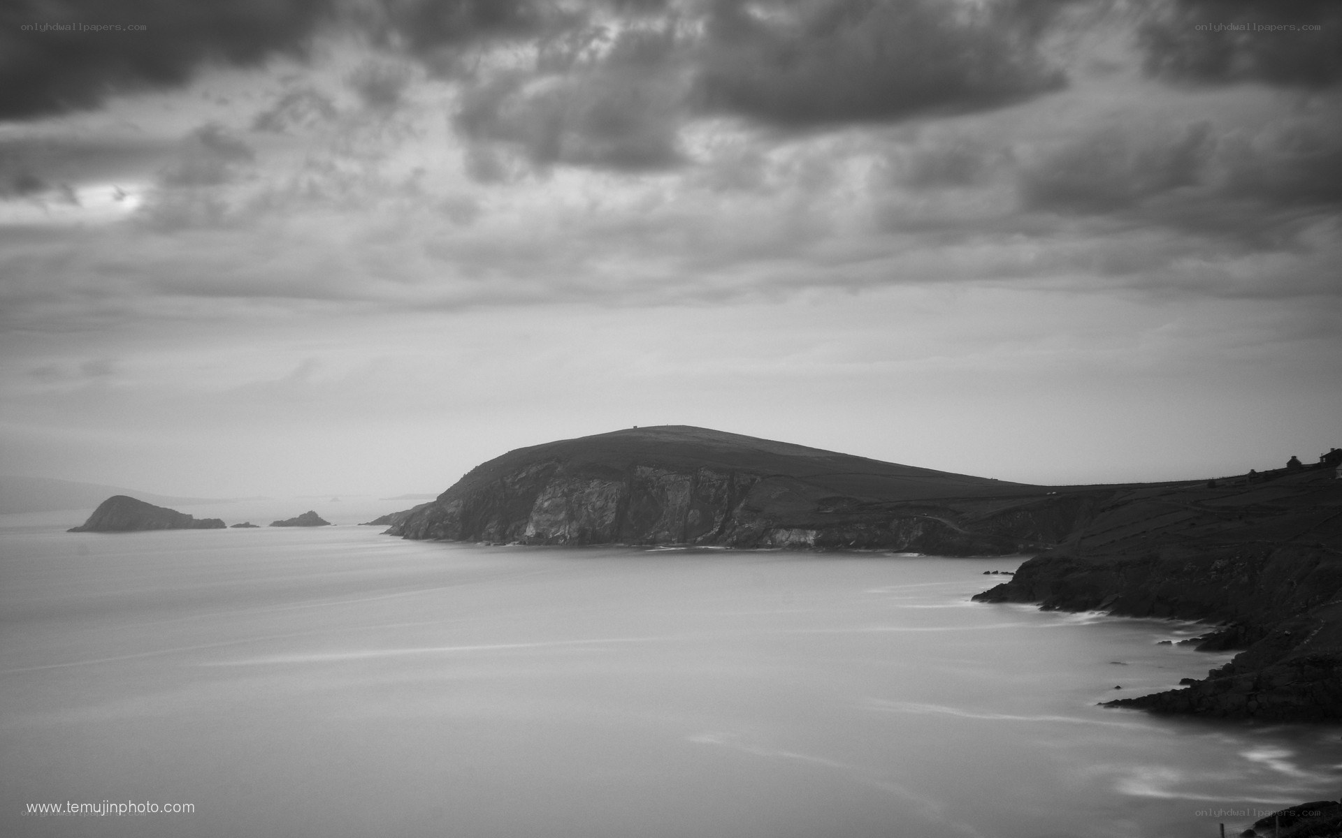 coastal cliffs under cloudy sky