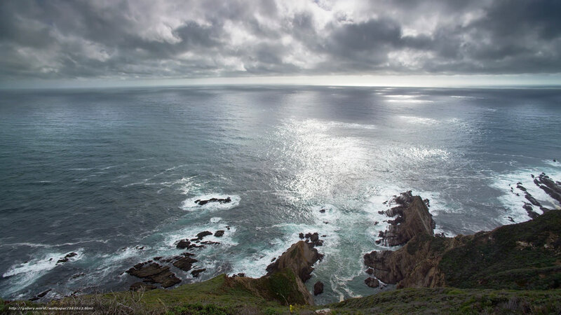 coastal cliffs under cloudy sky