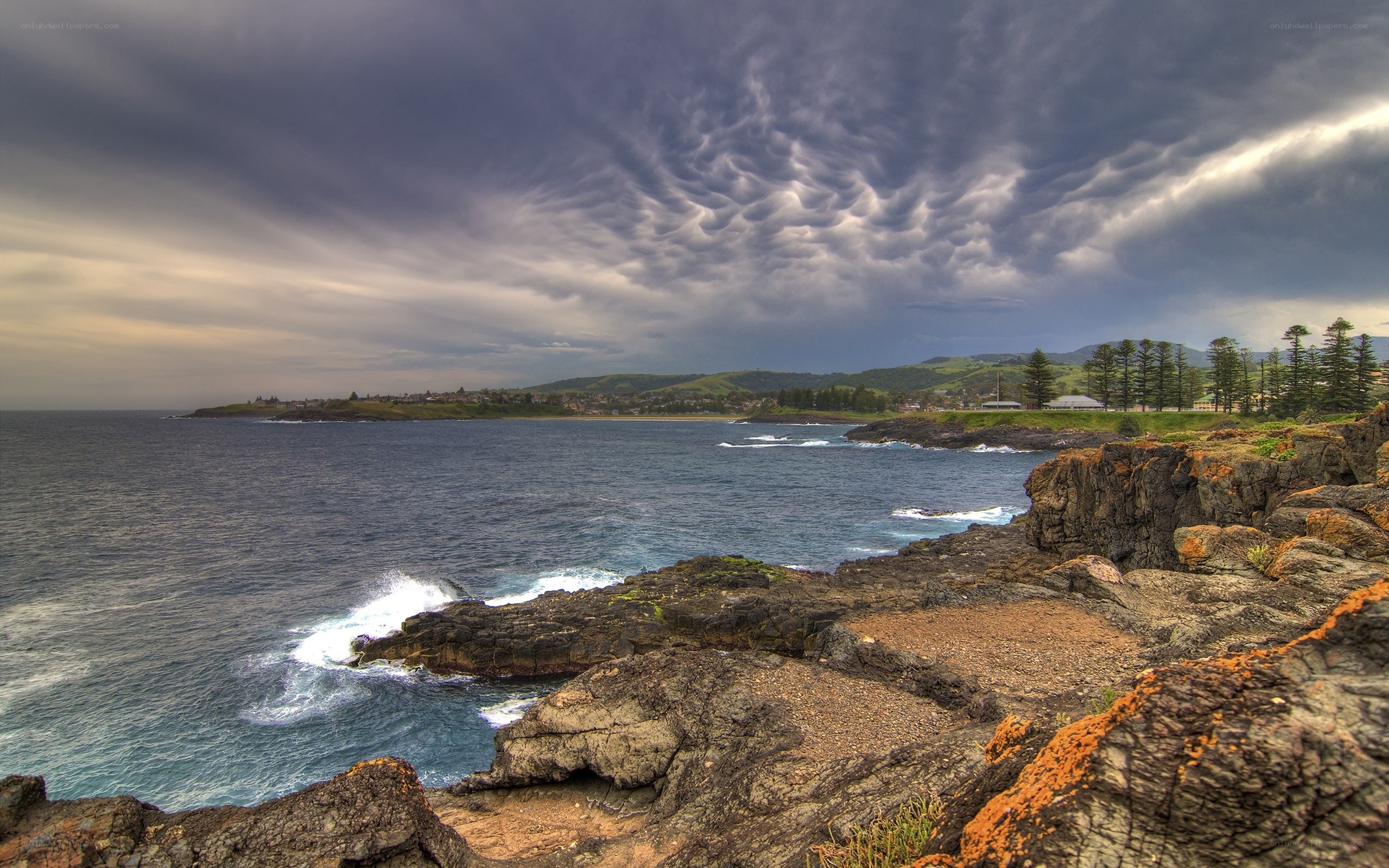 coastal cliffs under stormy sky