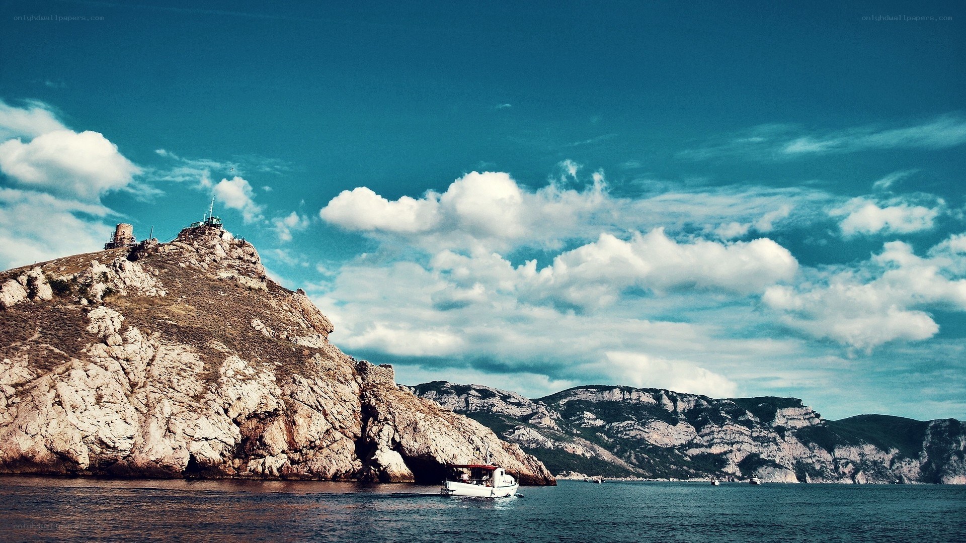 Coastal cliffs with boat and sky