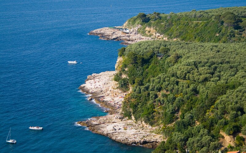 coastal cliffs with boats