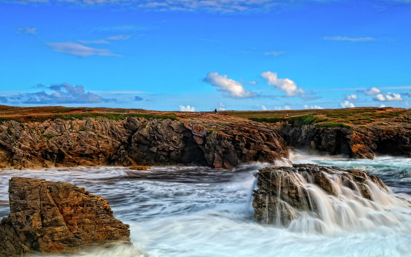 coastal cliffs with crashing waves