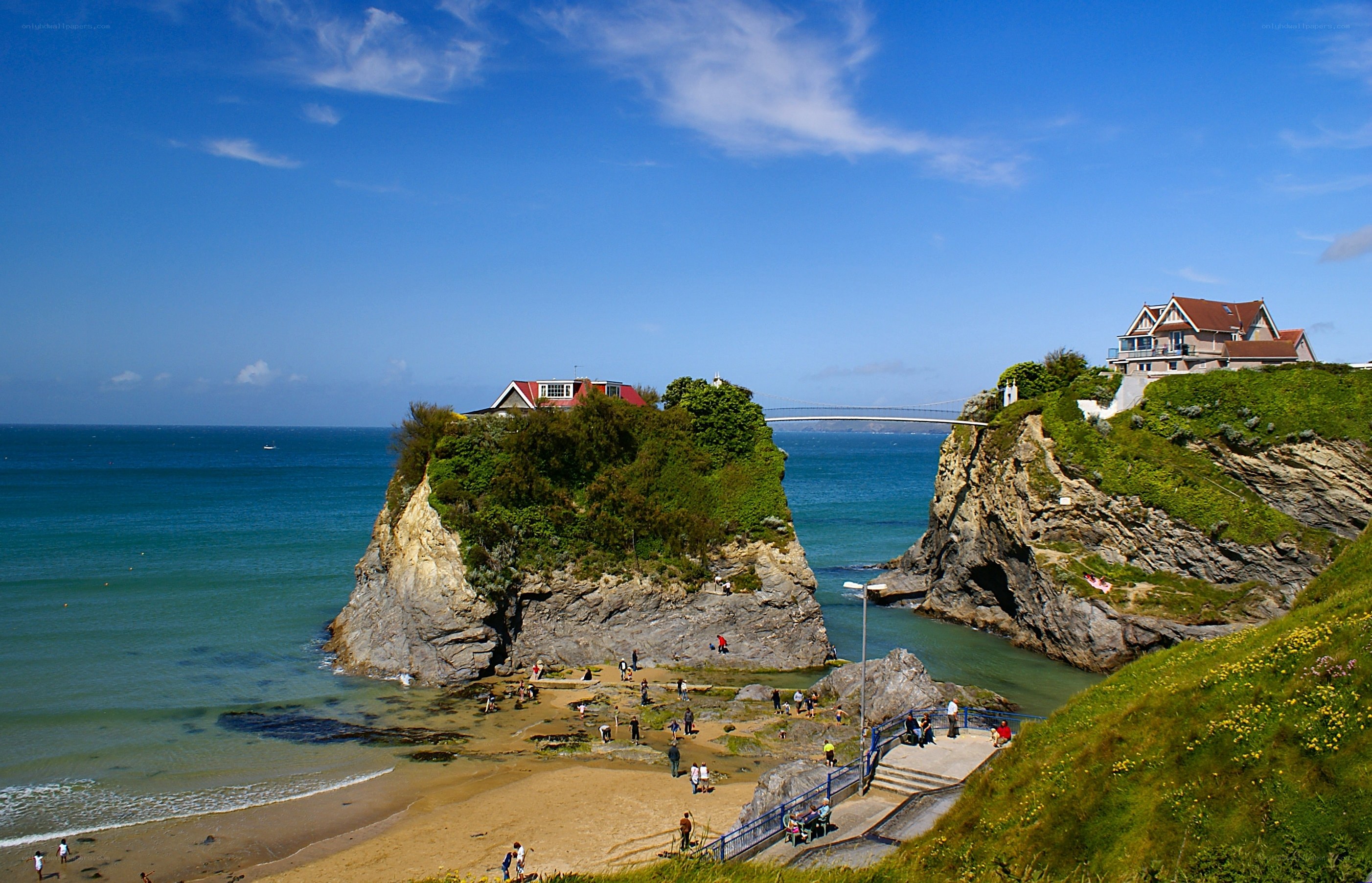 coastal cliffs with houses and beach