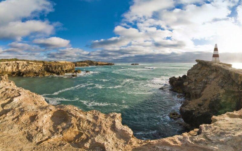 coastal cliffs with lighthouse