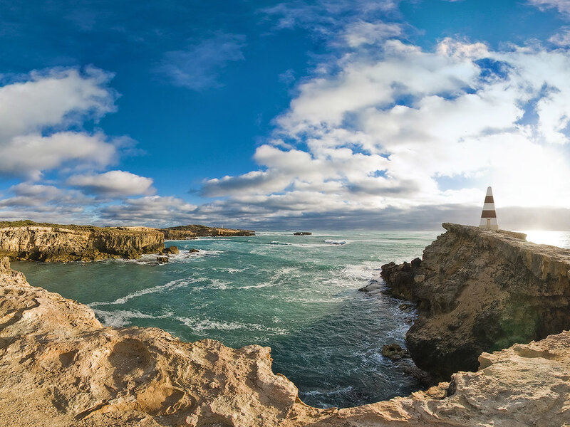 Coastal cliffs with lighthouse