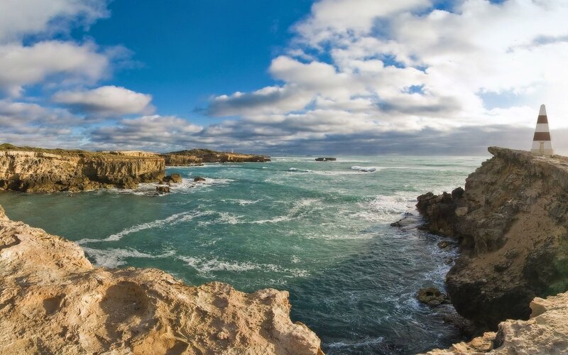 Coastal Cliffs with Lighthouse — Blue, Dramatic