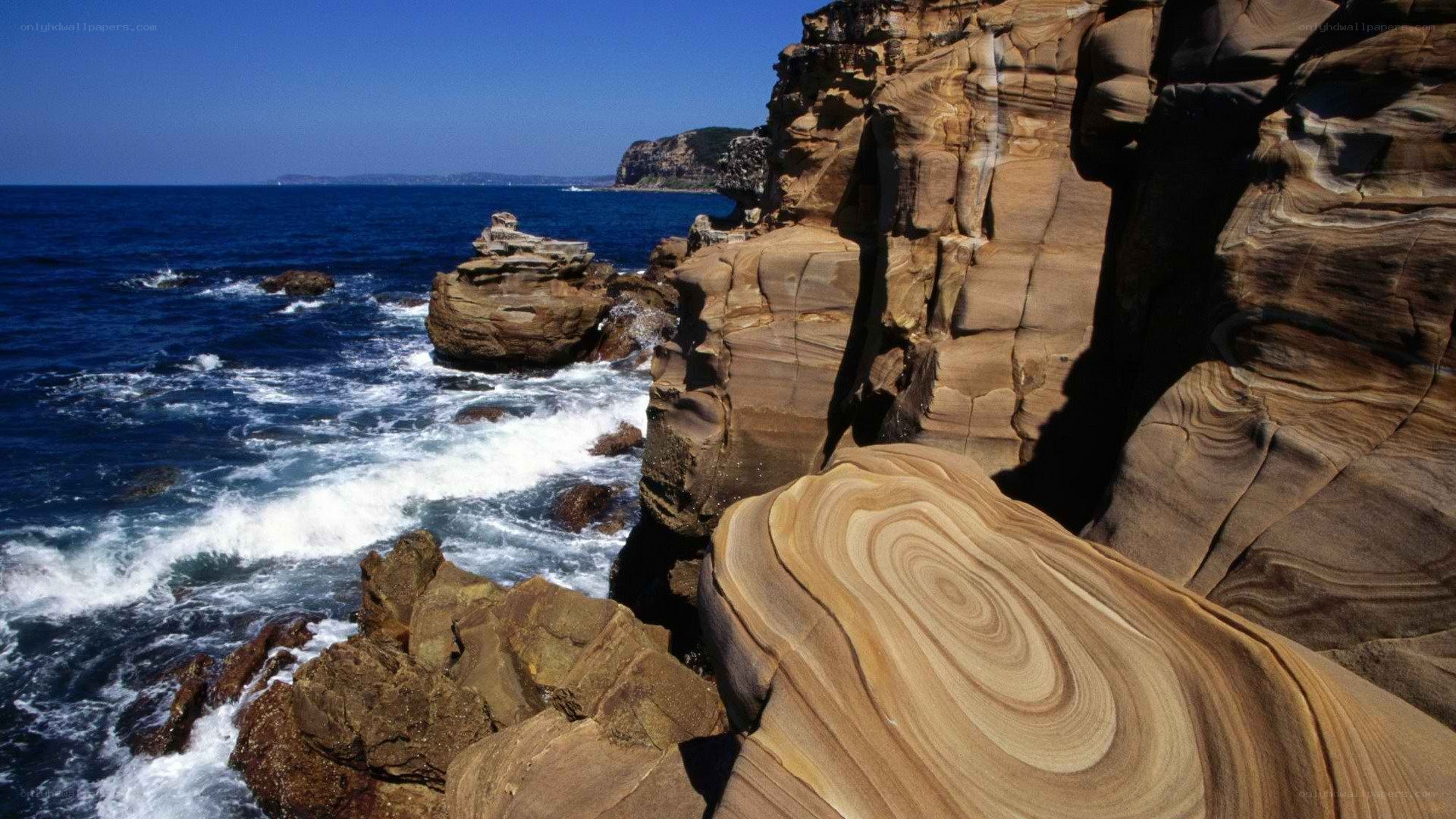 coastal cliffs with wave patterns