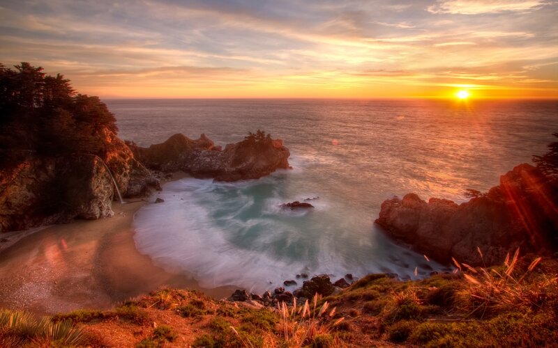 Coastal Cove at Sunset — Orange, Serene, Photograph, Ocean, Rocks, Trees