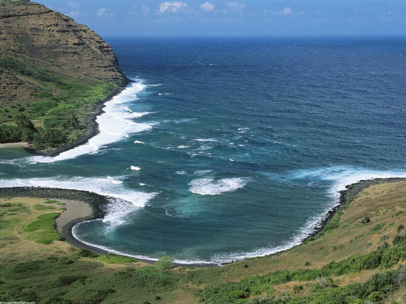 coastal cove with green hills