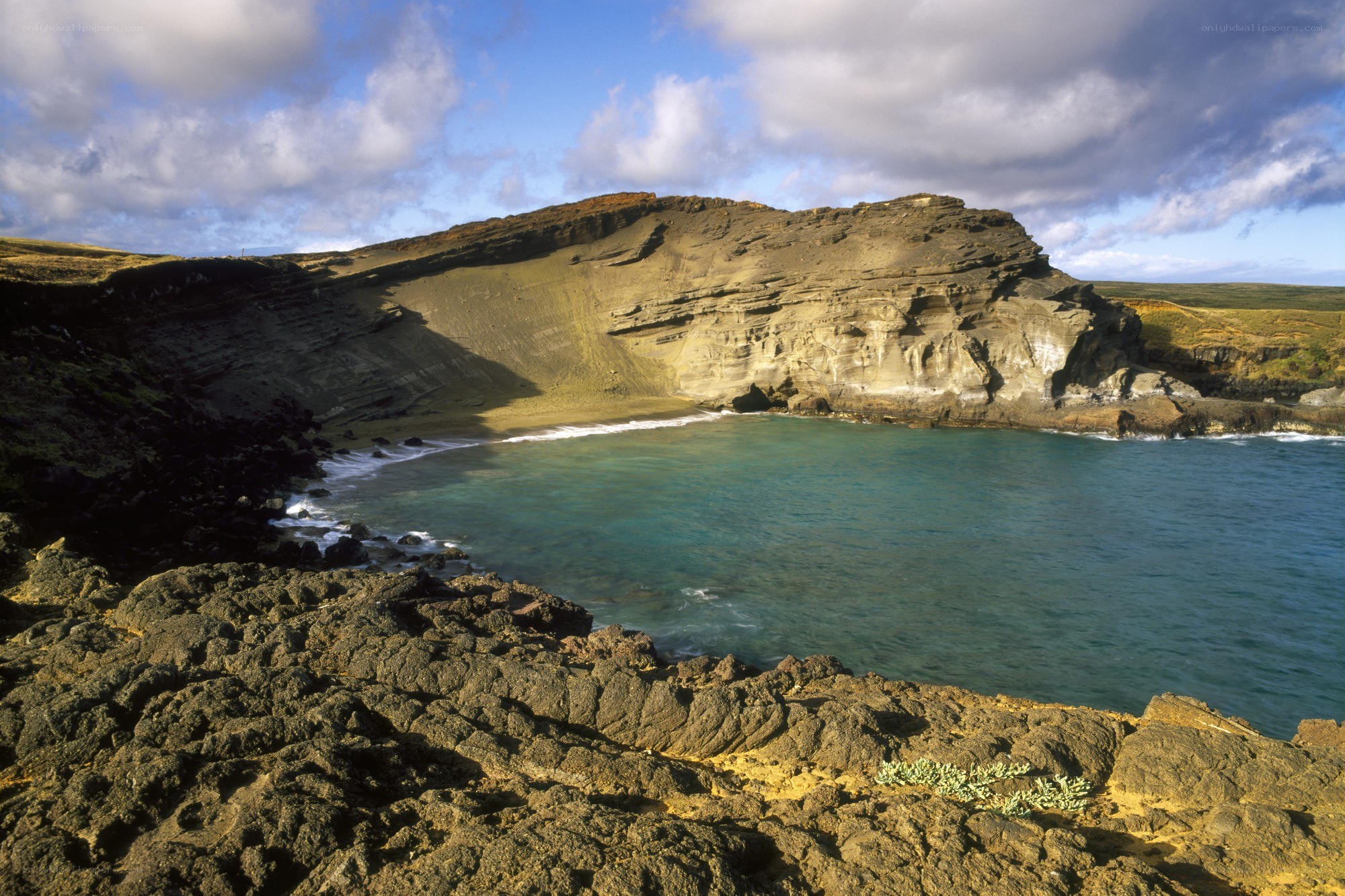 coastal cove with volcanic cliffs