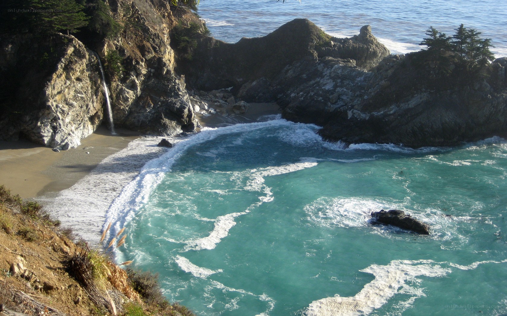 coastal cove with waterfall