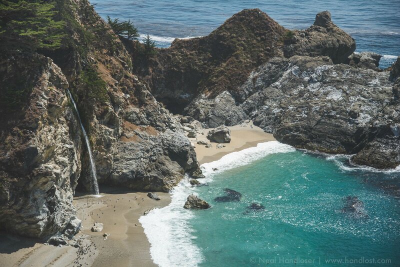 Coastal Cove with Waterfall — Blue, Serene, Afternoon, Photograph, Beach, Ocean, Cliffs