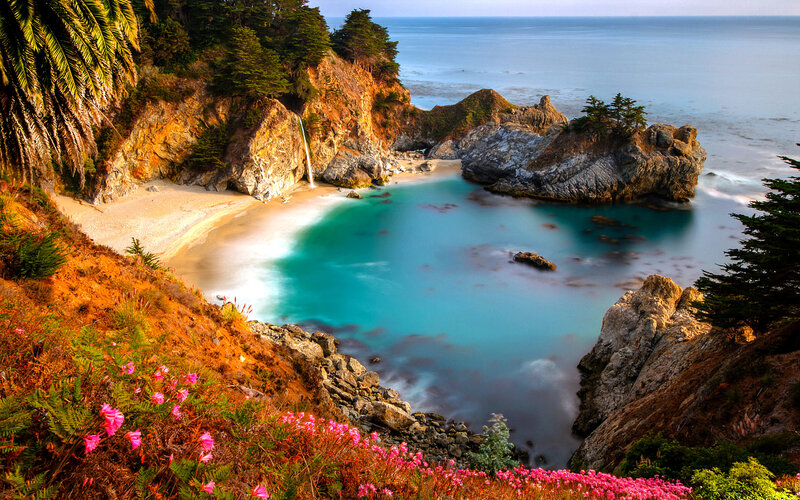 Coastal Cove with Waterfall — Blue, Serene, Afternoon, Photograph, Beach, Rocks