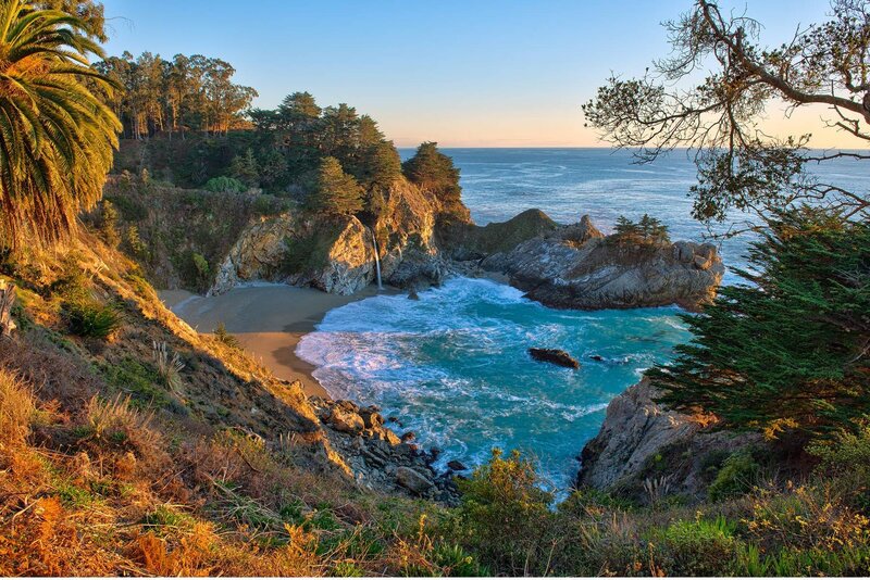 Coastal Cove with Waterfall — Blue, Serene, Sunset, Photograph, Palm Tree, Trees