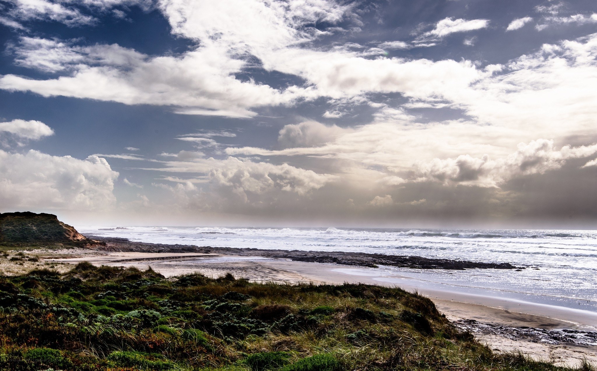 Coastal dunes and ocean waves