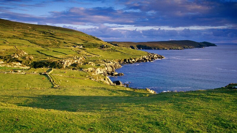 coastal green hills at sunset