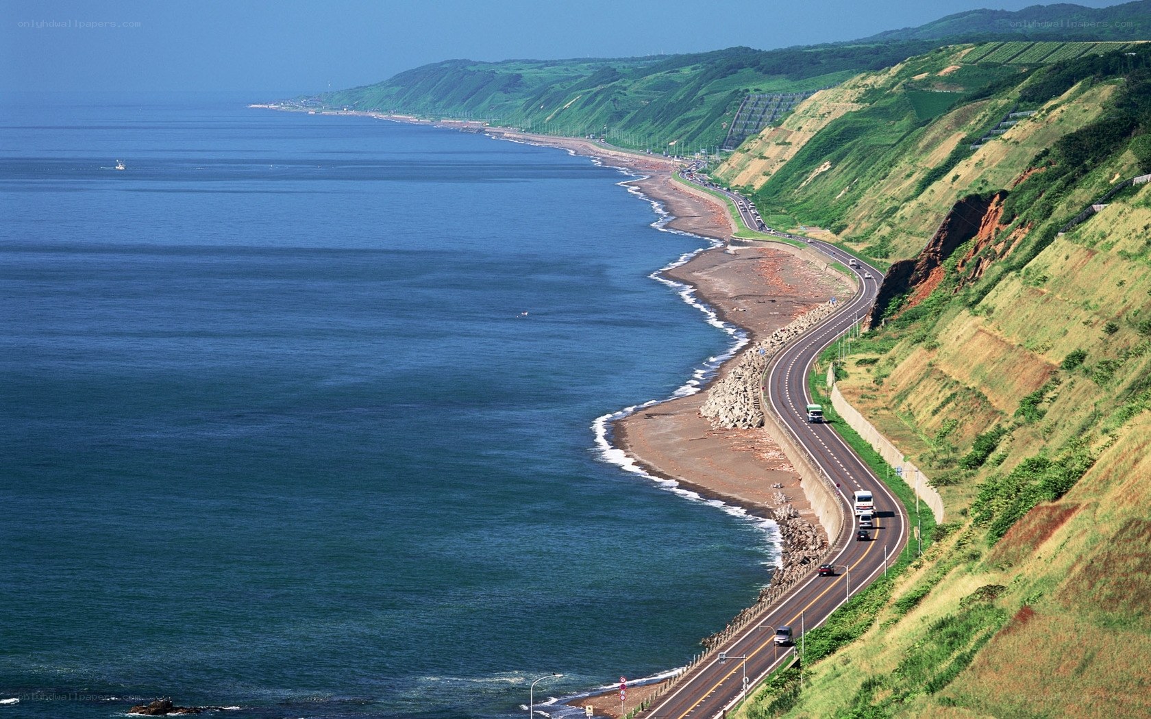 coastal highway along green cliffs