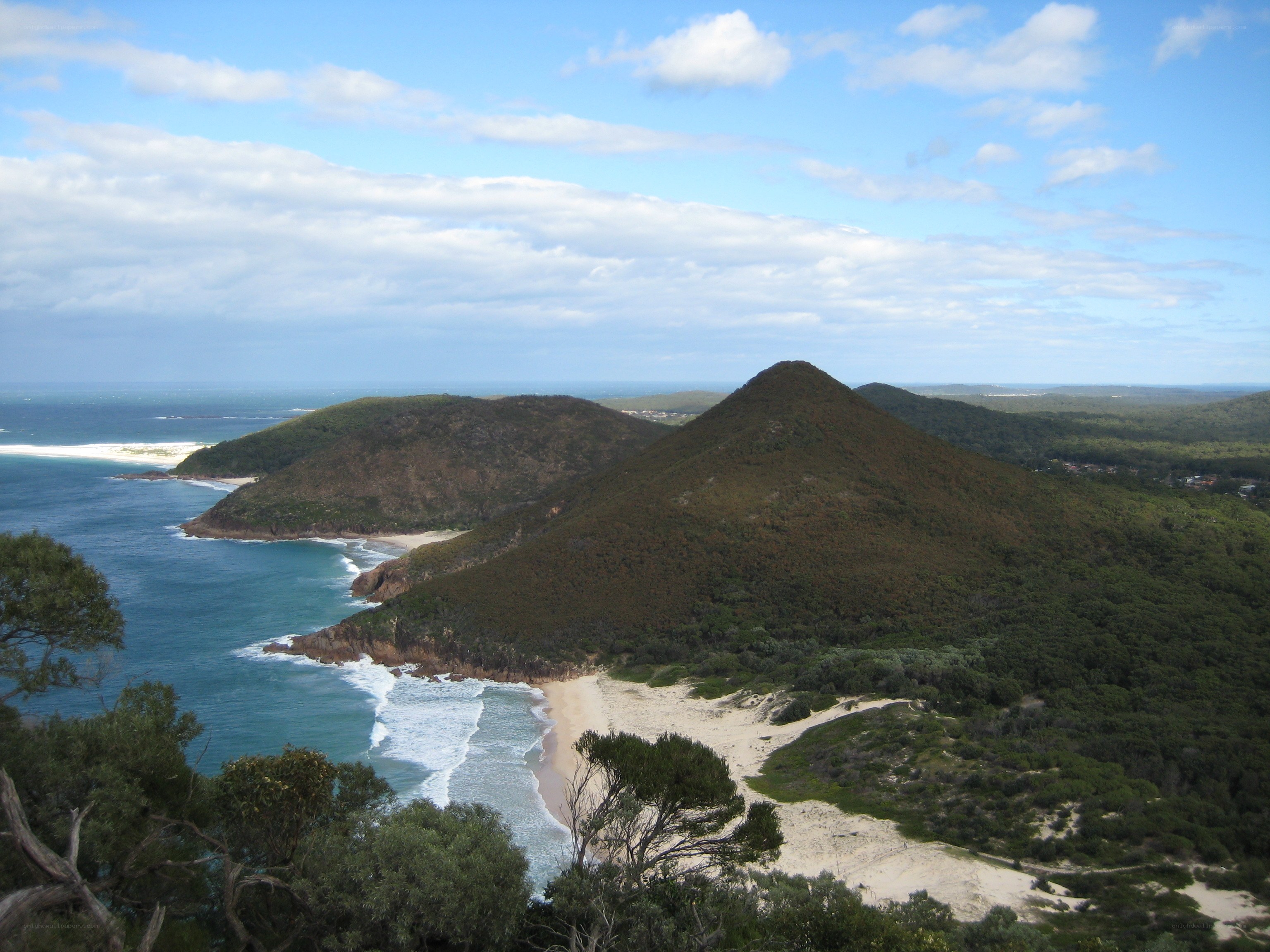coastal hills and sandy beach