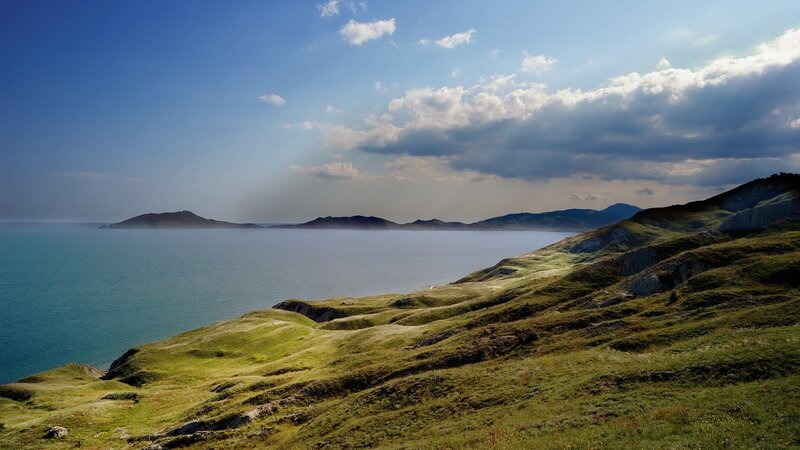 Coastal hills overlooking a calm sea