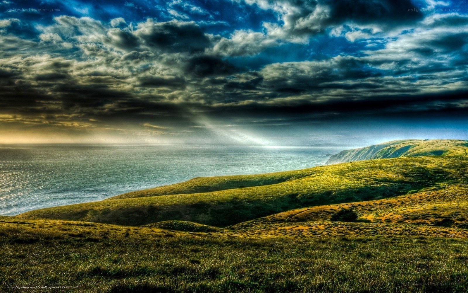 Coastal hills under dramatic sky