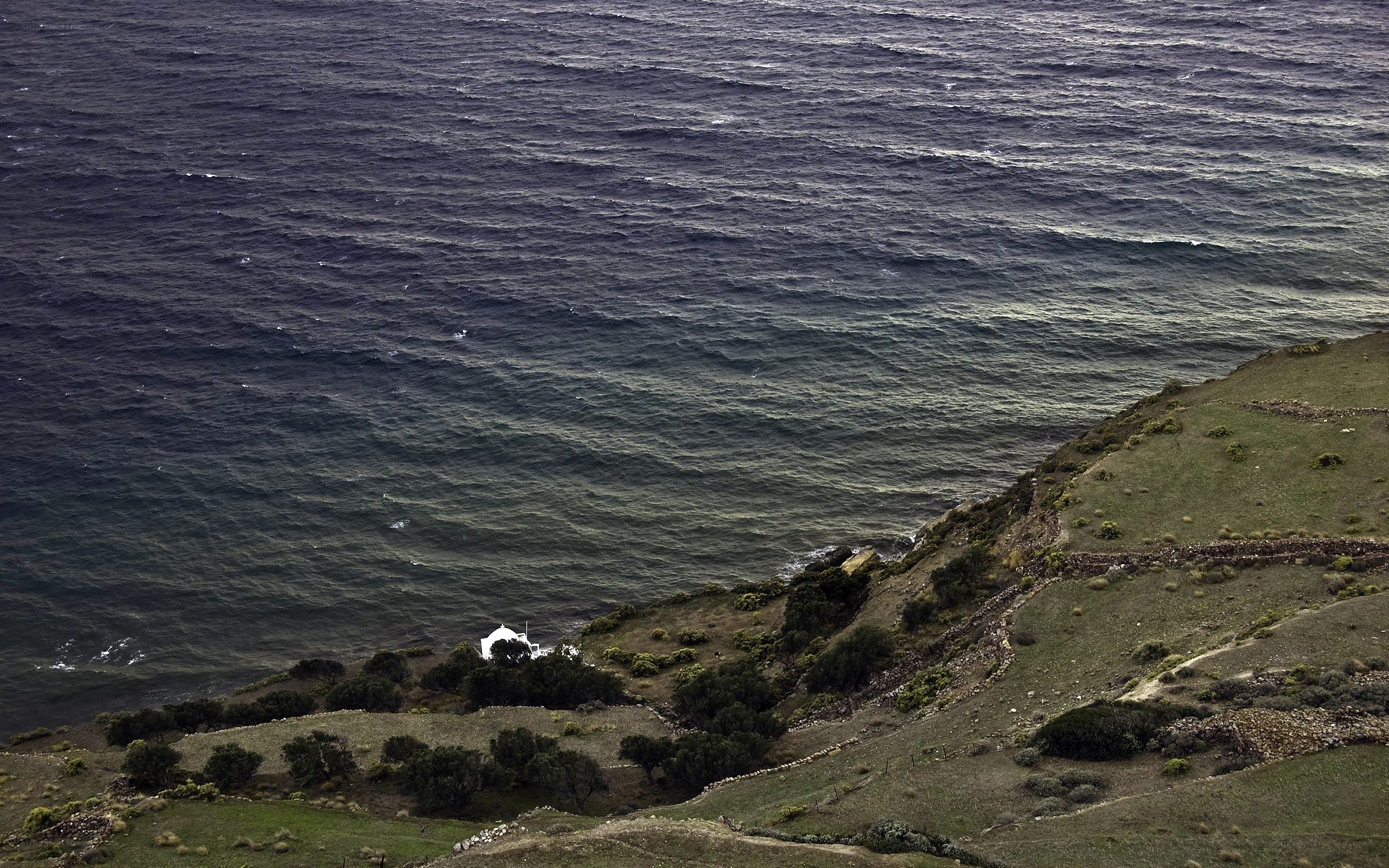 coastal hillside with lighthouse