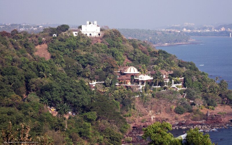 coastal hillside with white buildings