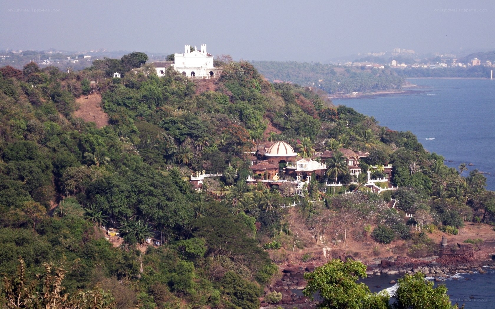 coastal hillside with white buildings