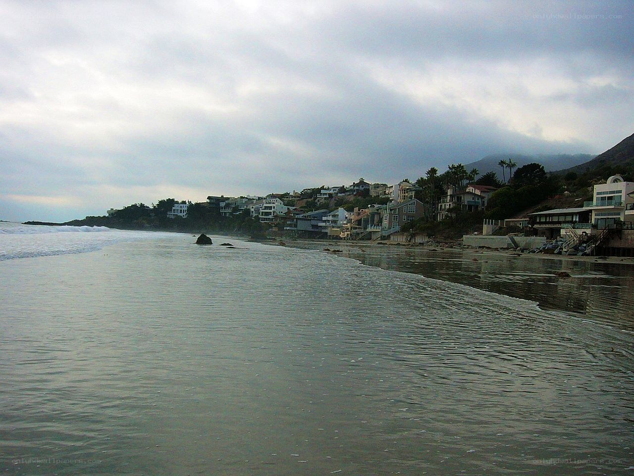 coastal homes under cloudy sky