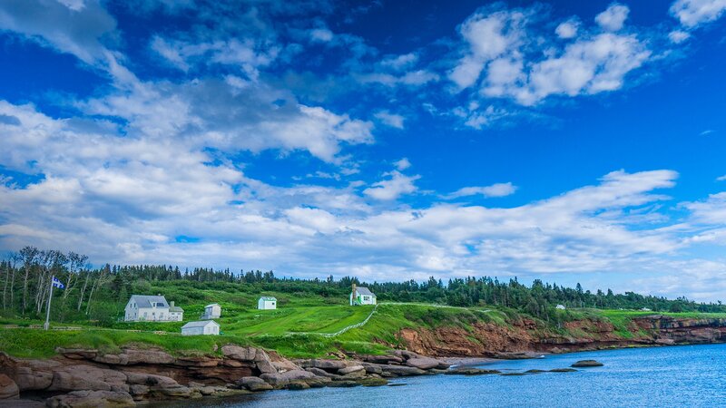 Coastal Houses on Cliff — Blue, Serene, Afternoon, Photograph