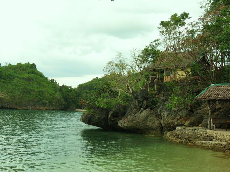 Coastal hut on rocky shore