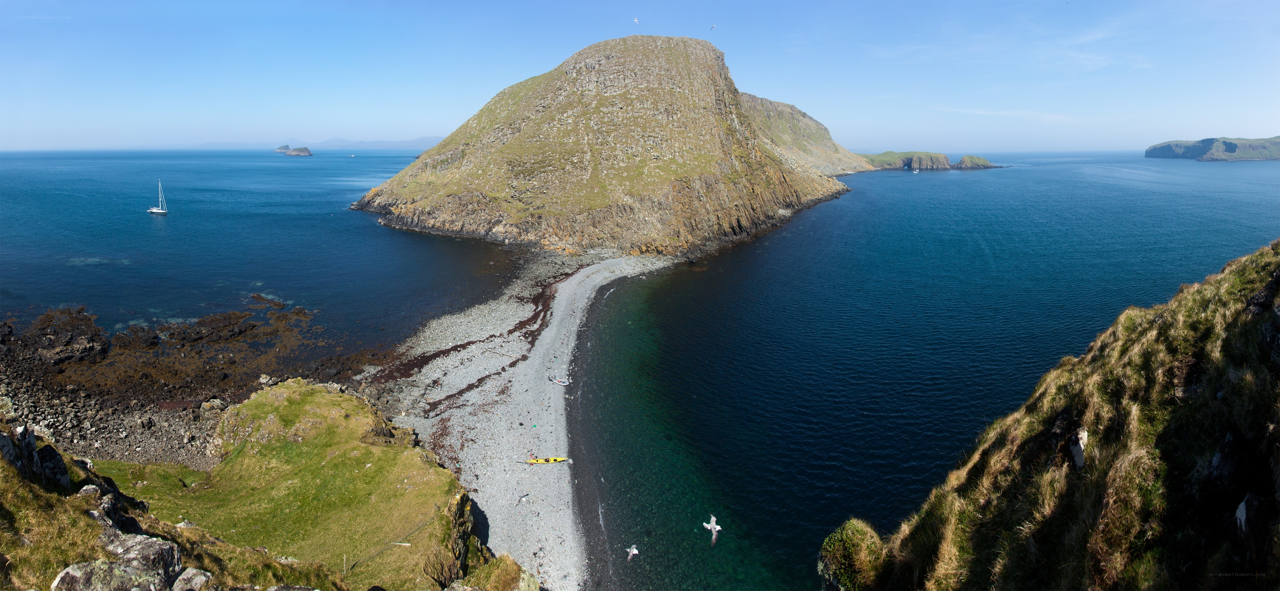 coastal island with pebble beach
