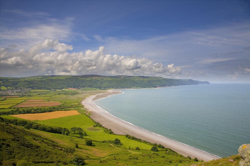 coastal landscape with beach and fields