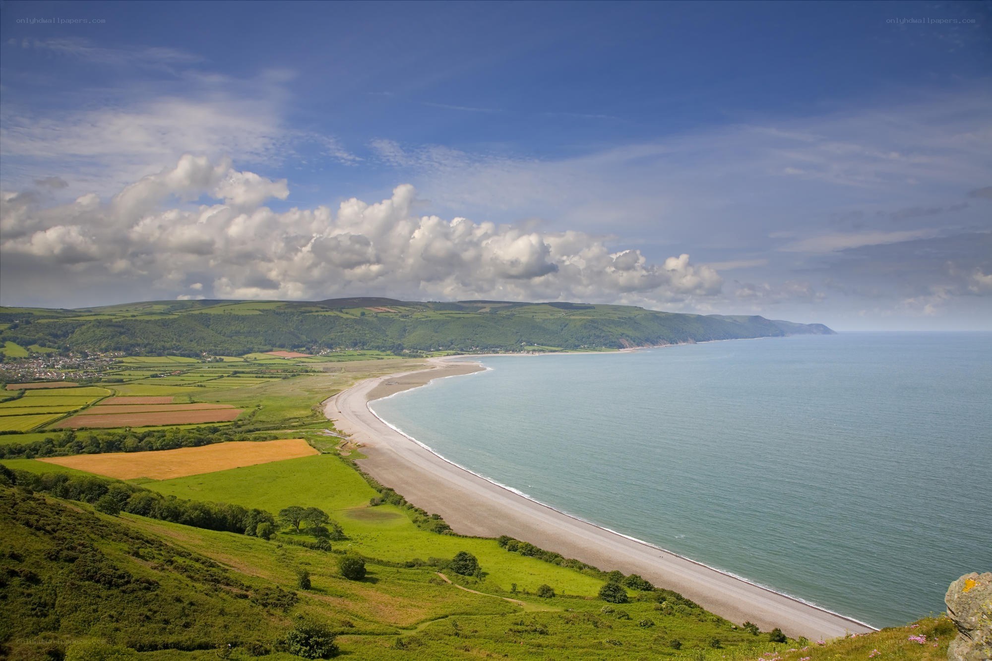 coastal landscape with beach and fields