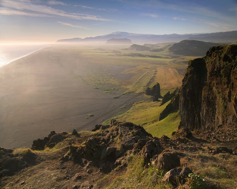 coastal landscape with black sand beach