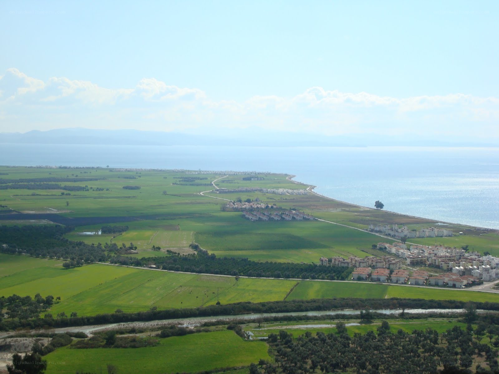 coastal landscape with fields and sea