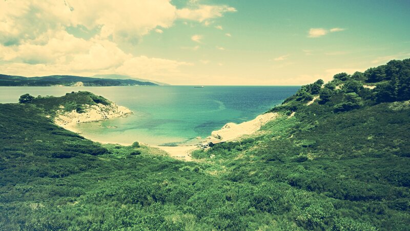 Coastal landscape with green hills