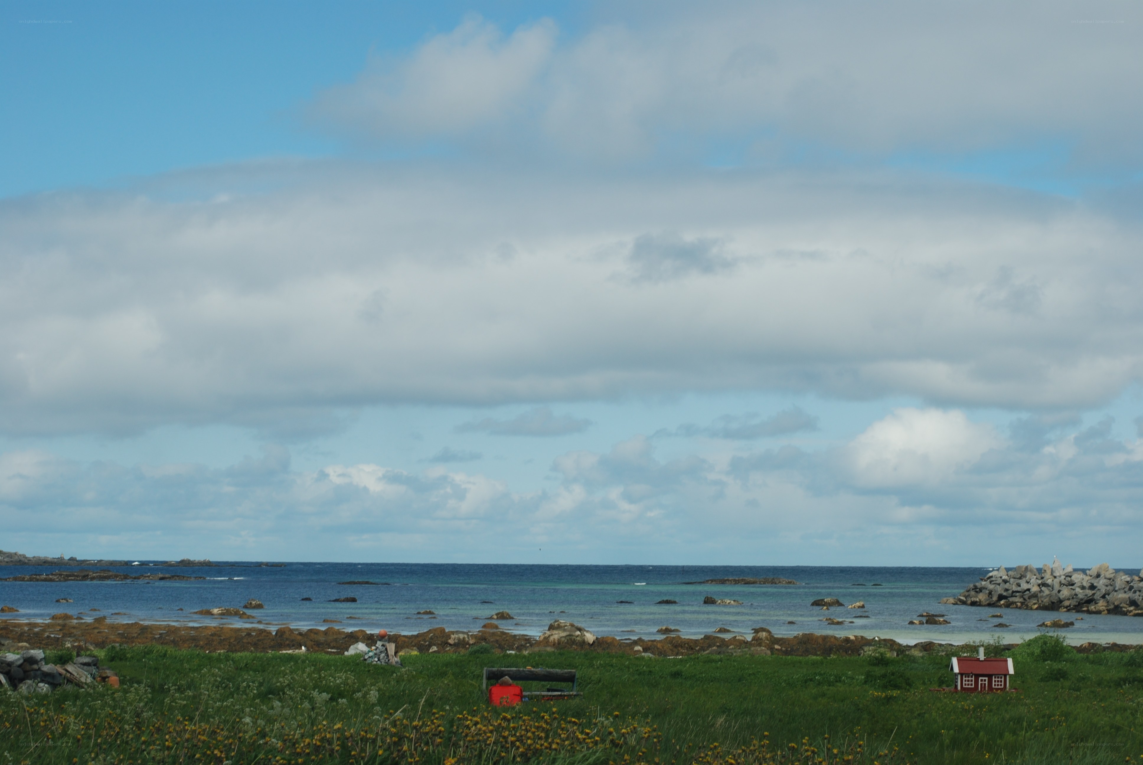 Coastal landscape with red house